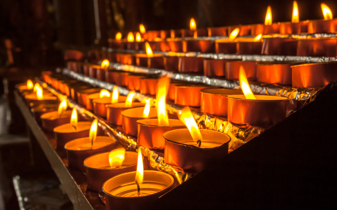Group of votive candles in a church on Christmas eve